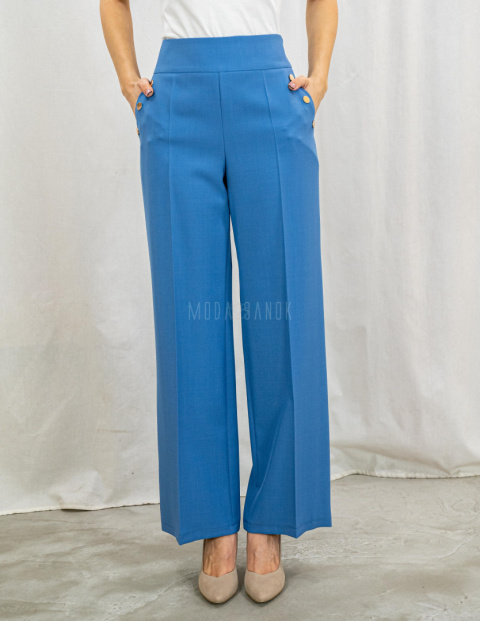 Jasnoniebieskie eleganckie spodnie damskie z szeroką nogawką i rzędowymi guzikami CORALLINE- MODA SANOK Jasnoniebieskie eleganckie spodnie damskie z szeroką nogawką i rzędowymi guzikami CORALLINE- MODA SANOK