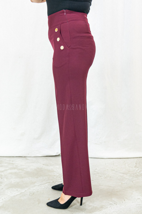Bordowe eleganckie spodnie damskie z szeroką nogawką i rzędowymi guzikami CORALLINE- MODA SANOK Bordowe eleganckie spodnie damskie z szeroką nogawką i rzędowymi guzikami CORALLINE- MODA SANOK