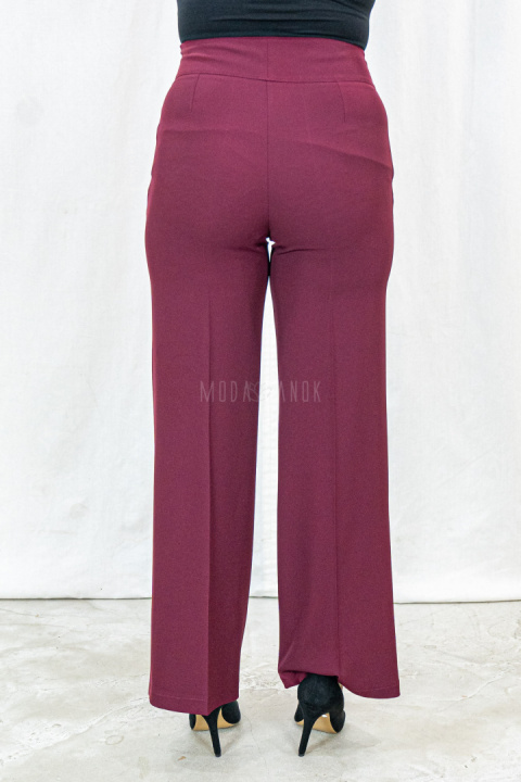Bordowe eleganckie spodnie damskie z szeroką nogawką i rzędowymi guzikami CORALLINE- MODA SANOK Bordowe eleganckie spodnie damskie z szeroką nogawką i rzędowymi guzikami CORALLINE- MODA SANOK